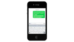Smartphone with a text message open, displaying a promotional offer with a discount code and URL.