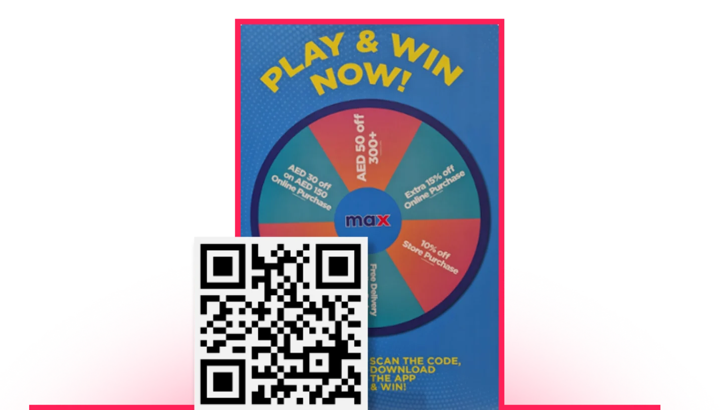 A "Play & Win Now" promotional poster for the Max app featuring a spin wheel with prizes including AED 50 off orders over 300, extra 15% off online purchases, 10% off in-store purchases, free delivery, and AED 30 off orders over AED 150, with a QR code and text inviting users to scan, download the app, and win.