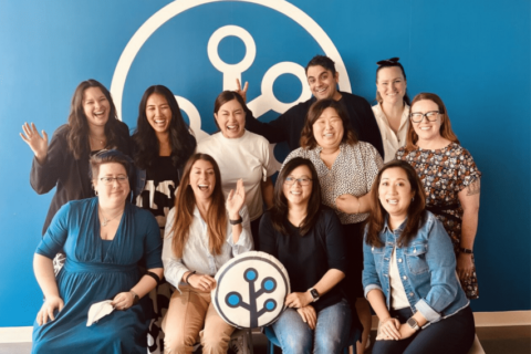 photo of branch team smiling and waving with branch logo