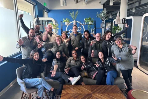 Photo of branch team members cheering and smiling